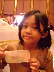 Tina showing off her Bosnian money